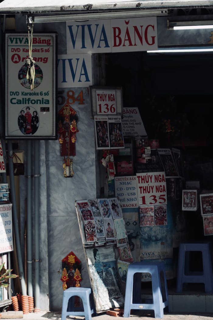 A Vietnamese store with vibrant karaoke advertisements and cultural decorations.