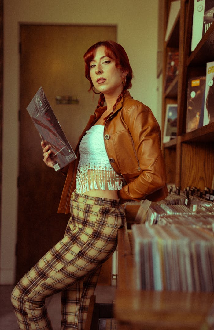 vintage-style-woman-browsing-vinyl-records-34165226